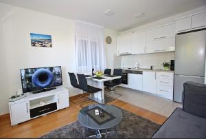 Kuchyň nebo kuchyňský kout v ubytování Apartman BartuLina