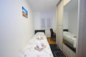 Postel nebo postele na pokoji v ubytování Apartman BartuLina