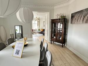 a dining room with a table and chairs at Boutique-Aalborg-Free parking - Citycenter in Aalborg