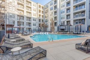 an image of a swimming pool at a apartment complex at CozySuites Modern Midtown Condo Unit 06 in Nashville