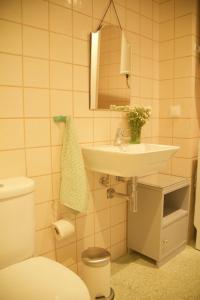 a bathroom with a sink and a toilet at Irlandas Villa Funchal Seaside Villas in Funchal