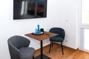 TV a/nebo společenská místnost v ubytování Berg Fux - 1-Raum Apartment Alex der Hase