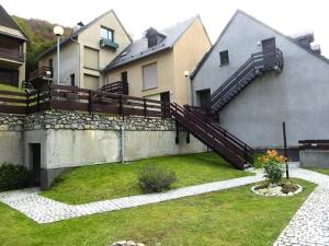 a house with a staircase on the side of it at Résidence Marmottes - Studio cabine avec place de parking couvert privé MAE-8274 in Barèges