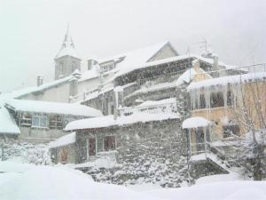 a snow covered building with snow on top of it at Résidence Lienz - Studio cabine avec terrasse exposée Sud MAE-8324 in Barèges