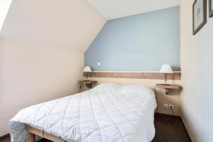 Ένα ή περισσότερα κρεβάτια σε δωμάτιο στο Les Maisons de Belle Dune - maeva Home - Maison 3 pièces 6 pers Sélection MAE-1398