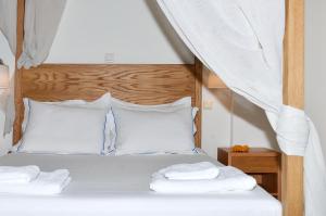 A bed or beds in a room at Keros Art Hotel