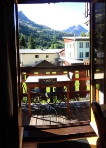 a view from a window of a table on a balcony at Résidence Pre Malin - 2 Pièces pour 4 Personnes 84 in Valloire