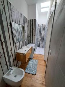 Koupelna v ubytování Appartamenti Calliope + 10 fotografií