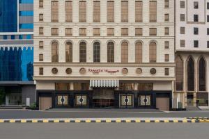 a building with a store in front of it at Ramada by Wyndham Makkah Zad Al Rawda in Makkah