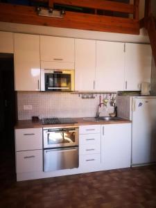 Kuchyňa alebo kuchynka v ubytovaní Résidence Parc Et Avenue Dominica - 2 Pièces pour 4 Personnes 784