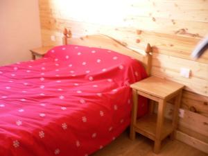 מיטה או מיטות בחדר ב-Chalet Les Aiguilles - Pièces 34