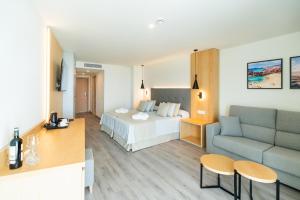 Postel nebo postele na pokoji v ubytování HL Rondo Hotel