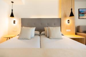 Postel nebo postele na pokoji v ubytování HL Rondo Hotel