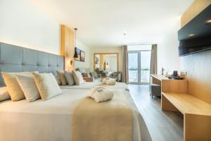 Postel nebo postele na pokoji v ubytování HL Rondo Hotel