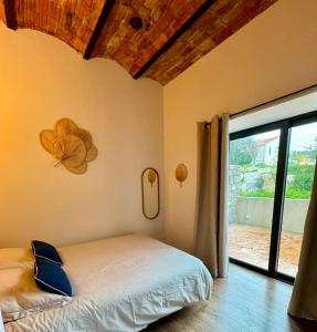 Posteľ alebo postele v izbe v ubytovaní Mini villa avec piscine à 50m de la plage !