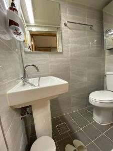 a bathroom with a sink and a toilet at Hanok guesthouse Ann 