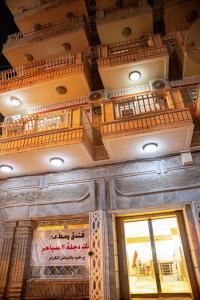 a building with a balcony on top of a building at Malik Dijlah Hotel in Baghdad