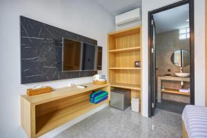 Ένα ή περισσότερα κρεβάτια σε δωμάτιο στο JnJ Guest House