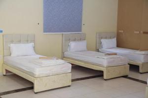 Krevet ili kreveti u jedinici u okviru objekta Ritaj Al Haramain 3