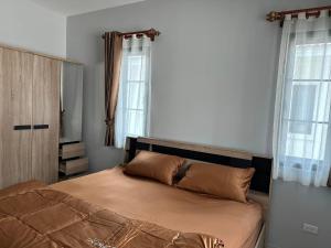 Postel nebo postele na pokoji v ubytování issara2 + 25 fotografií
