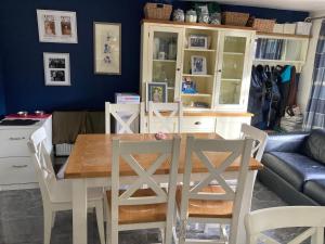 a dining room with a table and chairs at House on the corner in Thame
