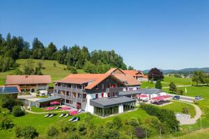an aerial view of a large building on a hill at Sontheims Naturhotel & Spa in Maierhöfen