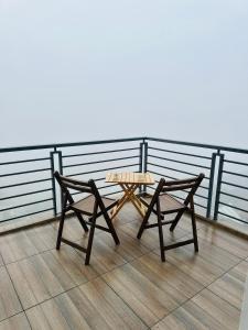 a picnic table and a bench on a roof at Western Ghats Holiday Home in Kalpetta