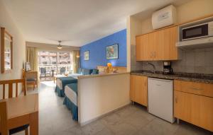 a room with a kitchen and a living room at whala!tenerife in Playa de las Americas