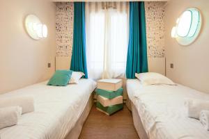Posteľ alebo postele v izbe v ubytovaní Résidence Presqu'Ile de la Touques - Appartement 3 pièces 6 personnes Prestige MAE-8822