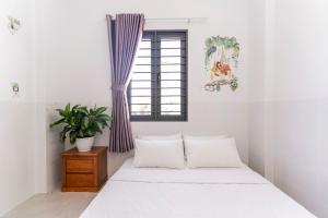 Ένα ή περισσότερα κρεβάτια σε δωμάτιο στο An An Homestay