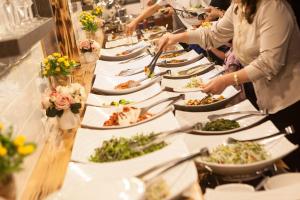 a buffet line of plates of food on a table at Acar Park Hotel in Dalyan