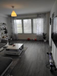 a living room with a couch and a table at Privat apartment Bojan in Malmö