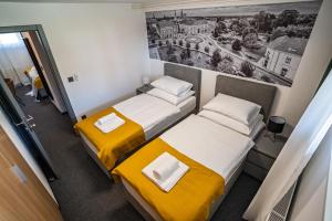 Postel nebo postele na pokoji v ubytování KM therooms BJELOVAR