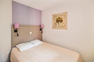 Postel nebo postele na pokoji v ubytování Résidence La Pinède - maeva Home - Appartement 2 Pièces 4 Personnes avec vue mer - Sélection MAE-6329 + 12 fotografií