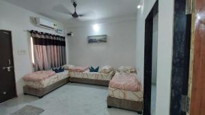 Voodi või voodid majutusasutuse UNiTY MADHAV HOMESTAY toas