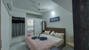 Voodi või voodid majutusasutuse UNiTY MADHAV HOMESTAY toas