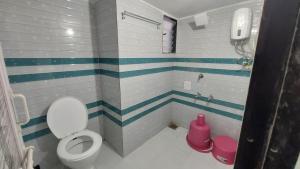 Vannituba majutusasutuses UNiTY MADHAV HOMESTAY
