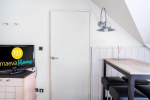 Televízia a/alebo spoločenská miestnosť v ubytovaní Le Domaine De Cramphore - maeva Home - Appartement 2 Pièces 4 Personnes - Confort MAE-8426