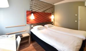 Postel nebo postele na pokoji v ubytování Hotel ibis Dijon Centre Clemenceau