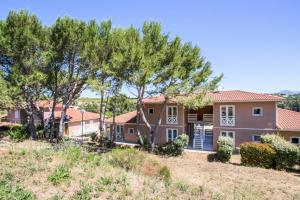a house on a hill with trees at Residence Debussy - maeva Home - Appartement 2 Pièces 4 Personnes - Budget MAE-9049 in Carnoux