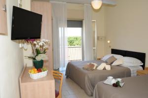 TV a/nebo společenská místnost v ubytování Hotel Lanzoni