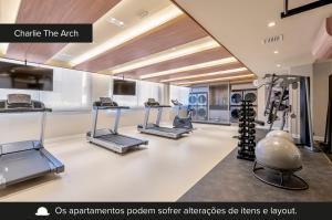 a gym with treadmills and exercise equipment in a room at Charlie The Arch Moinhos - Soft Opening in Porto Alegre