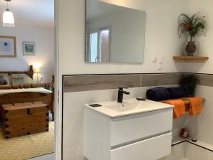 a bathroom with a white sink and a mirror at St Pasha in Paillé +117 photos