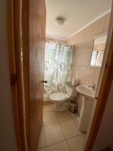 a bathroom with a toilet and a sink at Cabañas Voyage Atacama in San Pedro de Atacama