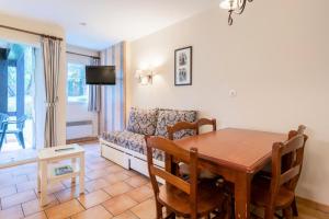Televízia a/alebo spoločenská miestnosť v ubytovaní La Résidence du Golf - maeva Home - Appartement 2 pièces 5 personnes - Confort MAE-5442
