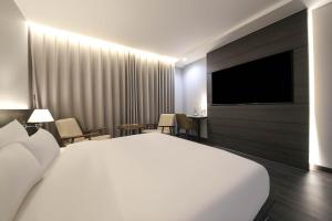 TV a/nebo společenská místnost v ubytování H Avenue Hotel Sangmu Branch