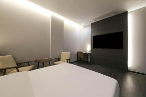 TV a/nebo společenská místnost v ubytování H Avenue Hotel Sangmu Branch