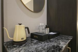 Příslušenství pro přípravu čaje a kávy v ubytování H Avenue Hotel Sangmu Branch