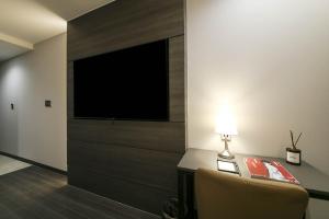 TV a/nebo společenská místnost v ubytování H Avenue Hotel Sangmu Branch
