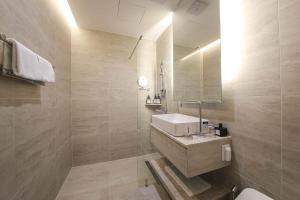 Koupelna v ubytování H Avenue Hotel Sangmu Branch